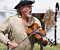 Buffalo Bill playing the fiddle and singing