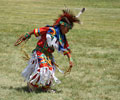 Young Wind River Indian dancer doing the Grass Dance