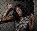 beautiful girl kept in cage at Morbid Nights Haunted House