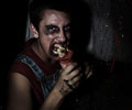 cannibal enjoys lunch at Morbid Nights Haunted House