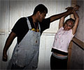 killer tortures beautiful woman at Morbid Nights Haunted House