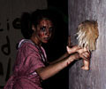 Lizzie Borden waits for more friends at Morbid Nights Haunted House
